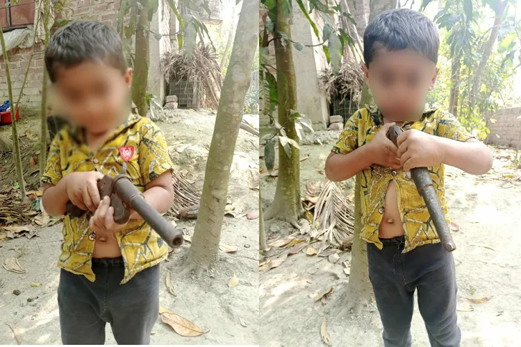আসল বন্দুক হাতে শিশুর ছবি ভাইরাল, এলাকায় চাঞ্চল্য